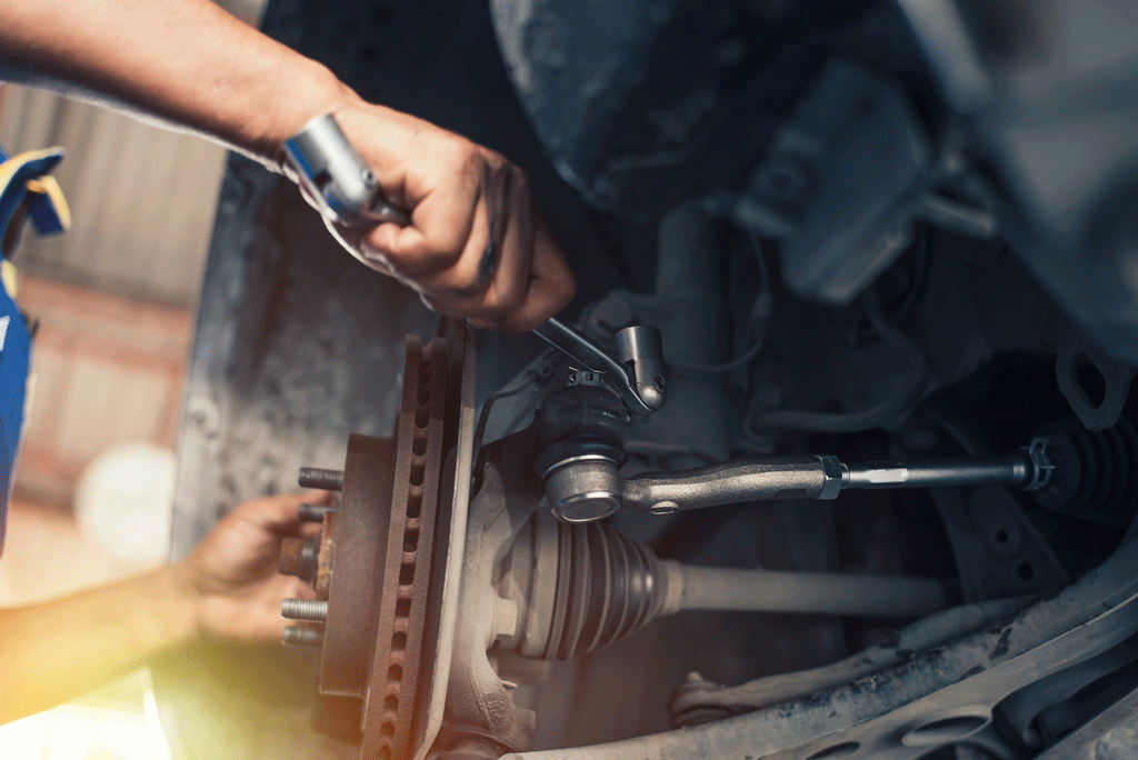 mechanics hand using wrench to tighten wheel | wheel alignment | gretna la harvey la 