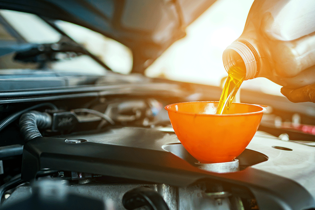 oil being put into funnel oil changes gretna la harvey la 