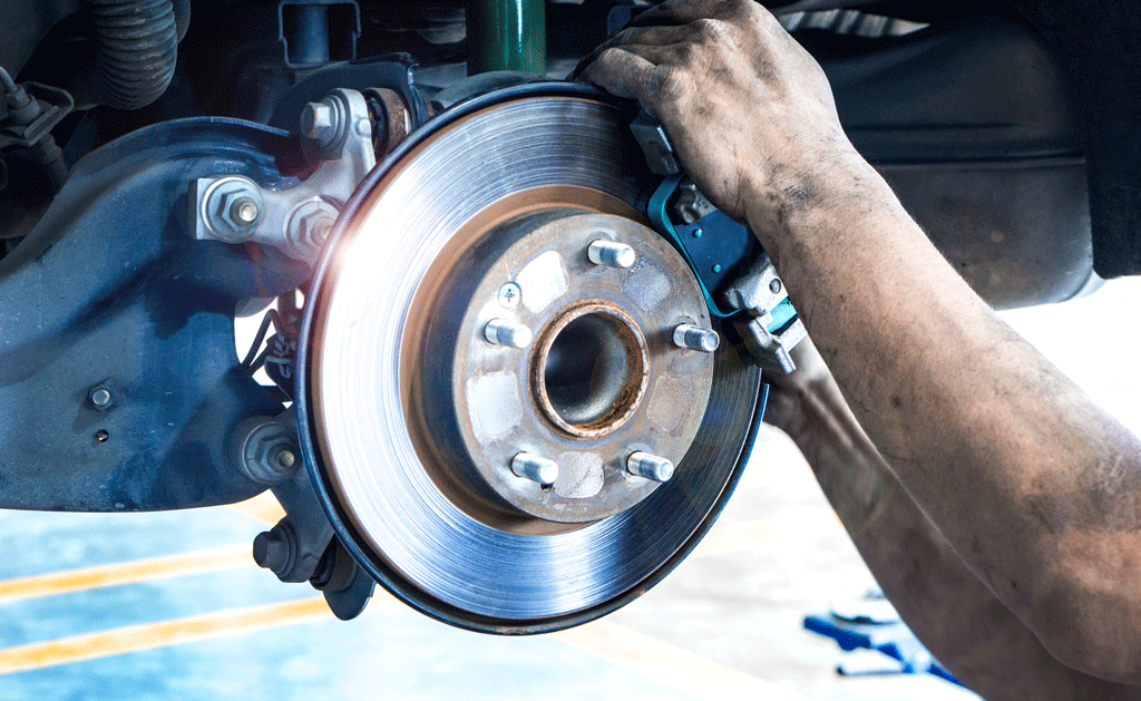 mans hands putting brakes on brake repair harvey la gretna la 